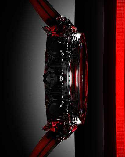 Close-up product shot of a black and clear wristwatch on a black and gray surface with a red accent light.