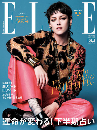 Elle magazine cover featuring Kristen Stewart in a leopard-print top and red pants, seated against a blue background. Magazine text visible.