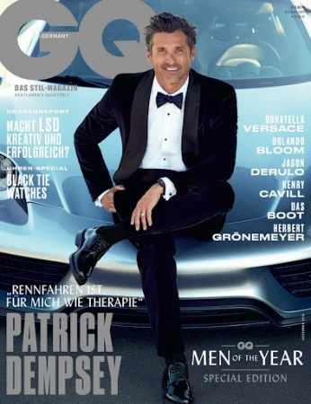 Patrick Dempsey on GQ cover. Portrait of smiling man in black velvet tuxedo sitting on a silver sportscar. GQ logo and magazine text visible.