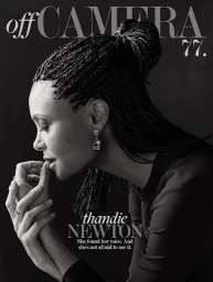 Monochrome portrait of Thandie Newton in profile wearing braided hair and drop earrings against a dark background with magazine typography