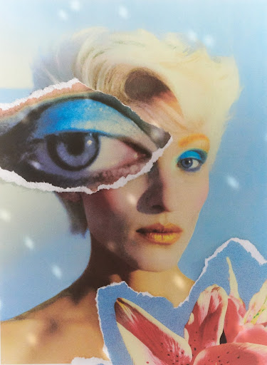 Blonde woman with makeup and flower in a collage-style portrait with an eye fragment, against a blue and white background.