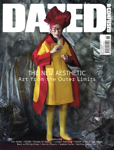 Dazed & Confused magazine cover featuring Iris Apfel in a yellow and red outfit holding a beverage, against a blurred background.