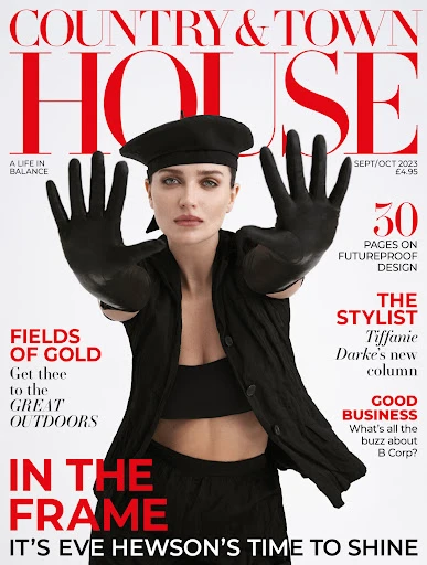 Magazine cover featuring a model with gloved hands up, set against the magazine title, 'Country & Town House' with a red and white logo.