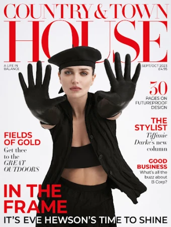Magazine cover featuring a model with gloved hands up, set against the magazine title, 'Country & Town House' with a red and white logo.