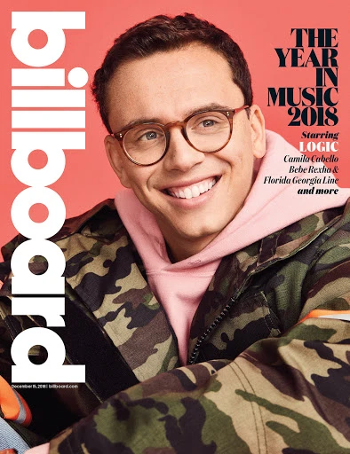 Billboard cover featuring Logic, with copy "The Year in Music 2018" in a studio headshot with camo jacket and pink hooded sweatshirt.