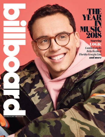 Billboard cover featuring Logic, with copy "The Year in Music 2018" in a studio headshot with camo jacket and pink hooded sweatshirt.
