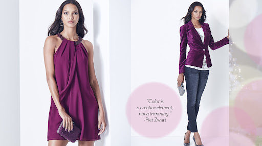 Two women fashion models showcase magenta outfits in a studio shot: one wears a dress and the other wears a blazer and jeans.