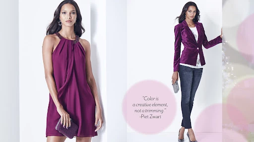 Two women fashion models showcase magenta outfits in a studio shot: one wears a dress and the other wears a blazer and jeans.