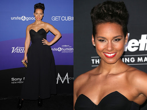 Alicia Keys poses on a purple carpet, wearing a formal black dress and holding a gold clutch. Close-up shows off her red lipstick.
