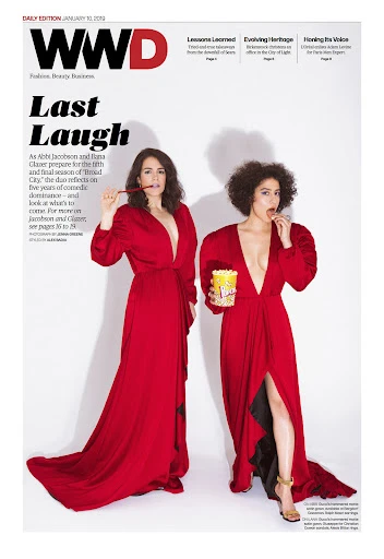 WWD magazine cover featuring adult women in red dresses with popcorn, one holding a pencil, against a white backdrop.