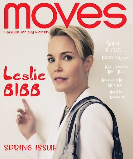 Moves magazine cover featuring Leslie Bibb. She's pictured in a white blazer with a neutral background and red magazine text.