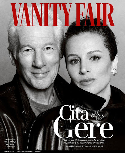 Black and white close-up of Richard Gere and Alejandra Silva on the cover of Vanity Fair magazine, smiling with leather jackets.