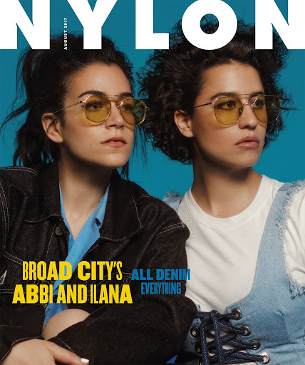 Nylon magazine cover featuring Abbi Jacobson and Ilana Glazer in denim, styled with yellow aviator sunglasses, against a teal background.