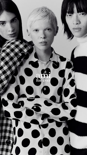 A black-and-white studio shot features three people posing in patterned shirts, the main focus on the center individual. Modern fashion.
