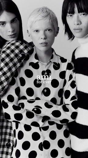 A black-and-white studio shot features three people posing in patterned shirts, the main focus on the center individual. Modern fashion.