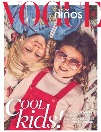 A fashion magazine cover shows a blonde-haired child and a dark-haired child wearing sunglasses, laying on a floral pattern with vogue logo.