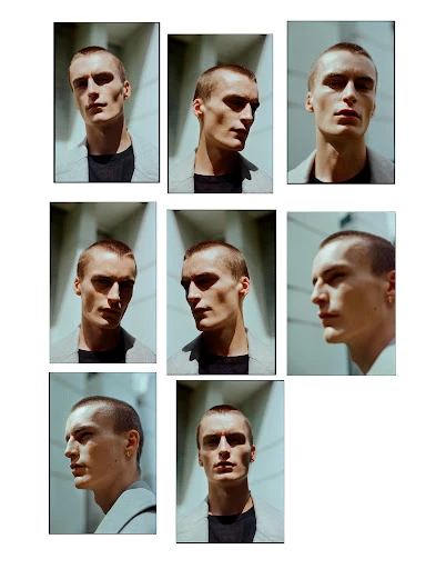 Multiple portrait views of a fair-skinned adult male with short hair, wearing a grey jacket in front of a bright, modern building facade.