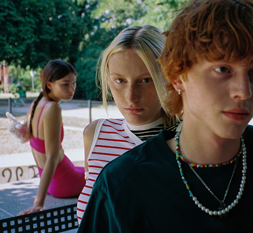 Three young models outdoors with make-up by Victoria Reuter in Paris