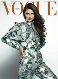 Taylor Hill wearing a metallic patterned jumpsuit on a white background for Vogue Mexico cover