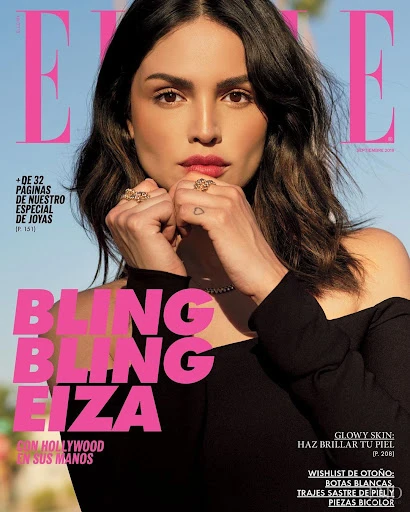 Elle magazine cover featuring Eiza González wearing jewelry and a black dress, with pink magazine text and white article headlines.