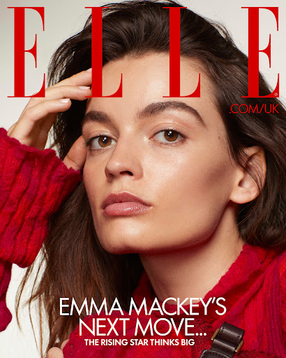 Emma Mackey on ELLE UK cover wearing a red sweater. Portrait shot of the actress in warm, diffused light with visible magazine text.