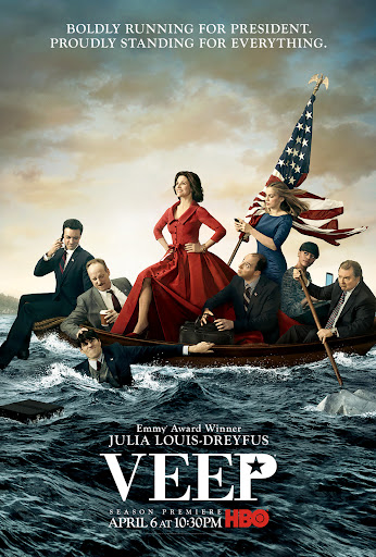 Promotional poster for the television series Veep featuring a group of people in a boat at sea, one woman standing with an American flag.
