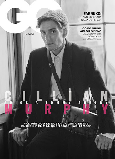 Monochrome portrait of Cillian Murphy wearing a dark coat and shoulder bag for a magazine cover by Gareth Bromell