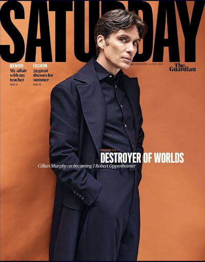 Cillian Murphy on magazine cover, wearing a dark suit and coat, against an orange background. The magazine is titled 'Saturday'.