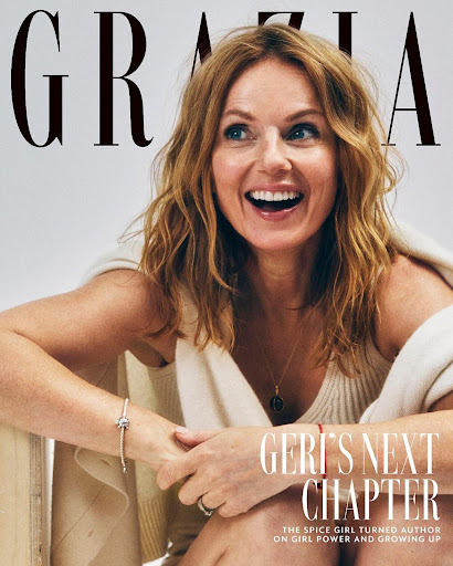 Geri Halliwell, formerly of the Spice Girls, smiles on the cover of Grazia magazine wearing a casual outfit with soft lighting.