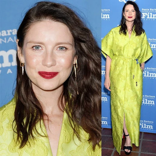 Caitriona Balfe attends the Santa Barbara International Film Festival in a lime-green gown, long brown hair, and red lipstick. 