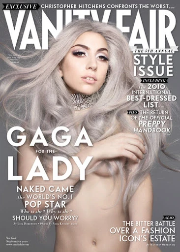 Vanity Fair magazine cover featuring a portrait of Lady Gaga with platinum blonde hair and silver necklace, against a muted grey backdrop.