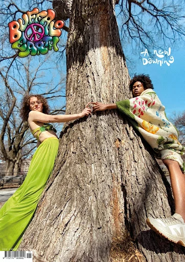 Fashion editorial cover featuring a man and a woman embracing a large tree outdoors under a blue sky; logo text reads 'Buffalo Soul'