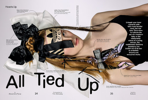 Fashion editorial featuring a fair-skinned model adorned with hair ribbons and headbands, lying against a white and black backdrop.