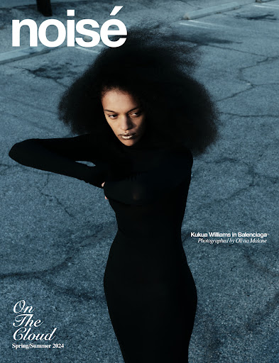 Fashion magazine cover featuring a Black woman with afro, wearing a black dress, posing against an urban background with visible text.