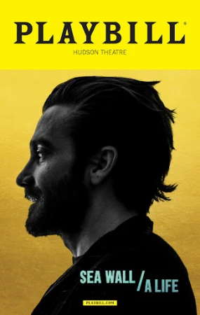 Promotional image for 'Sea Wall/A Life' play at Hudson Theatre. Headshot profile of Jake Gyllenhaal over a yellow background with play title text.