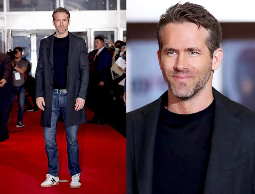Actor Ryan Reynolds poses in a full-length portrait and a close-up on a red carpet at a premiere event, wearing a black coat and jeans.