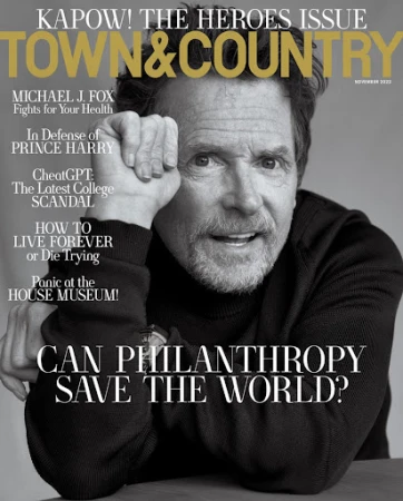 Magazine cover featuring Michael J. Fox in black and white, with a headline about philanthropy and health issues, against a neutral backdrop.