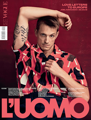 Actor Joel Kinnaman with arm tattoos wearing a pink patterned short-sleeve shirt for L Uomo magazine cover by Kristan Serafino