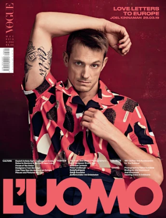 Actor Joel Kinnaman with arm tattoos wearing a pink patterned short-sleeve shirt for L Uomo magazine cover by Kristan Serafino