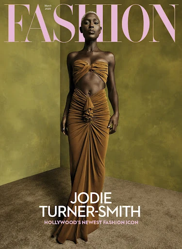 Fashion magazine cover featuring Jodie Turner-Smith in a gold dress, set against an olive green backdrop with stylish typography.