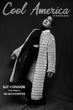 Magazine cover in black and white featuring Kit Connor in a crocheted jacket, black top and pants, with 'Cool America Summer 2022' text.