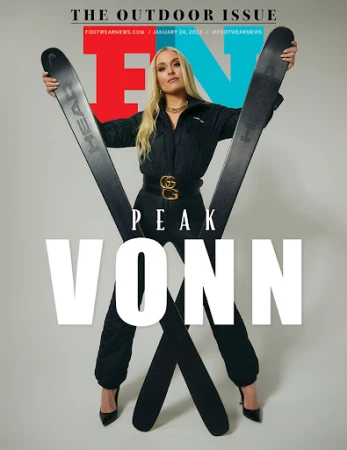 Footwear News cover featuring blonde woman in black outfit, holding skis, black high heels, and designer belt on a light background.