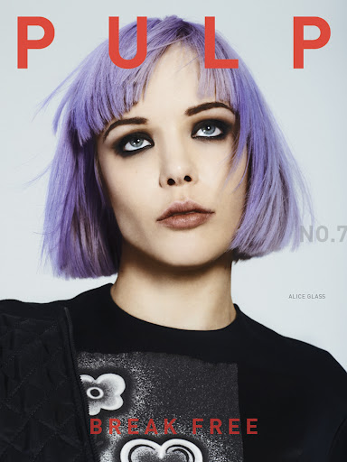 Magazine cover featuring a young woman with purple hair, heavy dark eye makeup, wearing a black graphic t-shirt, and bold 'PULP' text.