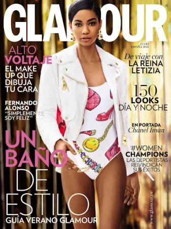 Chanel Iman on the cover of Glamour magazine wearing a white jacket and printed swimsuit with gold earrings.