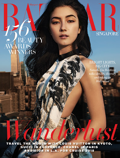 Magazine cover featuring a portrait of Natasha Liu Bordizzo, dark hair, wearing a patterned dress against a cityscape backdrop.