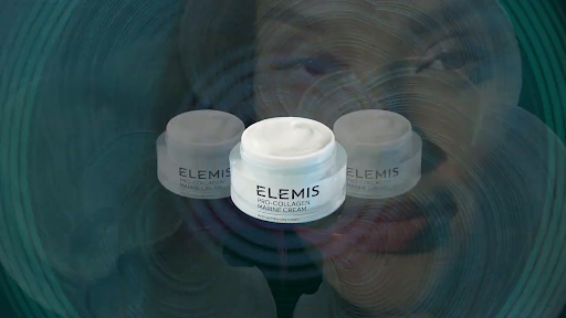 Three jars of Elemis Pro-Collagen Marine Cream are displayed against a blurred background featuring a woman's face and teal tones.