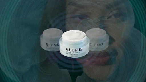 Three jars of Elemis Pro-Collagen Marine Cream are displayed against a blurred background featuring a woman's face and teal tones.