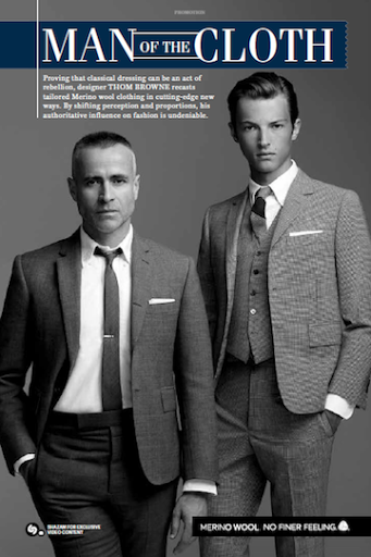 Two men in suits featured in an editorial-style fashion shot. One man in a suit with a tie, the other in a vest and suit.