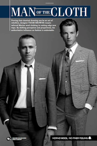 Two men in suits featured in an editorial-style fashion shot. One man in a suit with a tie, the other in a vest and suit.