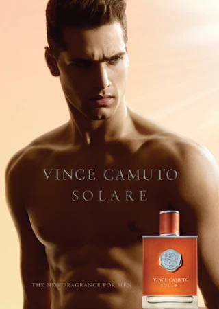 Advertisement for Vince Camuto Solare cologne, featuring a muscular adult male and the fragrance bottle against a warm orange background.